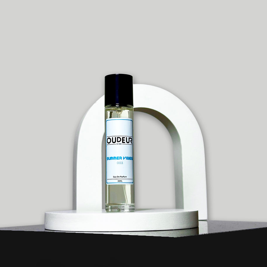 A bottle of perfume displayed on a white stand with a modern design, against a grey background. summer vibes Xerjoff Erba Pura